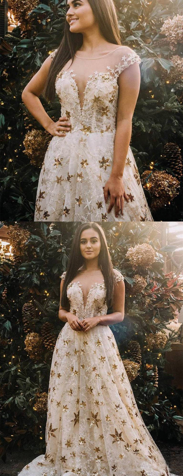 white dress with gold stars Showstopping Celestial Dresses With Stars and Moons